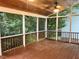 Cozy screened-in porch with views of trees surrounding the home at 725 Littleleaf Ct, Holly Springs, NC 27540