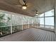Inviting screened-in porch featuring a wood ceiling, ceiling fans, and great natural light at 725 Littleleaf Ct, Holly Springs, NC 27540
