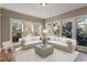 Cozy sunroom with comfortable seating, perfect for enjoying natural light and backyard views at 725 Littleleaf Ct, Holly Springs, NC 27540
