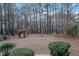 A sprawling backyard with mature trees and landscaping offering a private outdoor retreat at 725 Thompson Rd, Garner, NC 27529