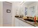 Bathroom featuring double sink vanity, stylish faucets, and great mirror at 725 Thompson Rd, Garner, NC 27529