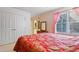 Bedroom with closet, window, and access to the ensuite bathroom at 725 Thompson Rd, Garner, NC 27529