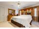 Relaxing bedroom with neutral decor, wooden headboard, and large dresser at 725 Thompson Rd, Garner, NC 27529