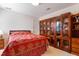 Cozy bedroom featuring beautiful wood built-ins for storage and a queen bed at 725 Thompson Rd, Garner, NC 27529