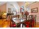Dining area boasting hardwood floors, a decorative fireplace, and ample natural light, ideal for Gathering meals at 725 Thompson Rd, Garner, NC 27529