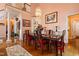 Elegant dining room with hardwood floors, chandelier, and stylish decor, perfect for hosting gatherings and meals at 725 Thompson Rd, Garner, NC 27529
