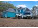 Beautiful backyard exterior of home with a deck and patio seating at 725 Thompson Rd, Garner, NC 27529