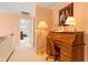Charming hallway featuring a rolltop desk, classic decor, and access to rooms at 725 Thompson Rd, Garner, NC 27529