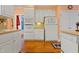 Spacious kitchen with hardwood floors, white cabinets, and plenty of room at 725 Thompson Rd, Garner, NC 27529