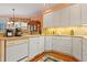 Well-lit kitchen with hardwood floors and ample counter space at 725 Thompson Rd, Garner, NC 27529