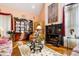 Inviting living area with hardwood floors, a fireplace, and ample seating, ideal for relaxation and entertainment at 725 Thompson Rd, Garner, NC 27529