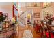 Spacious living room featuring hardwood floors, a staircase, and elegant decor, creating a comfortable atmosphere at 725 Thompson Rd, Garner, NC 27529