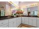 Well-lit primary bathroom with dual sinks, large vanity, and marble countertops at 725 Thompson Rd, Garner, NC 27529