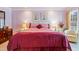 Spacious main bedroom with plush carpet, large bed, and picturesque windows at 725 Thompson Rd, Garner, NC 27529