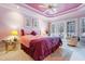 Elegant main bedroom with trey ceiling, ceiling fan, and private patio access at 725 Thompson Rd, Garner, NC 27529