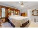 Spacious main bedroom with custom headboard, dresser, and ensuite access at 725 Thompson Rd, Garner, NC 27529