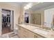 Bright bathroom features double sinks, granite countertops and access to walk-in closet and glass shower enclosure at 7250 Hwy 751 # 2109, Durham, NC 27707