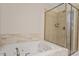 Bright bathroom features a jetted tub and glass shower enclosure at 7250 Hwy 751 # 2109, Durham, NC 27707