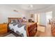 Bright bedroom features hardwood floors, plantation shutters, ceiling fan and bathroom access, providing a relaxing retreat at 7250 Hwy 751 # 2109, Durham, NC 27707