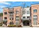 Elegant multi-story brick building with modern architectural details and well-maintained landscaping at 7250 Hwy 751 # 2109, Durham, NC 27707