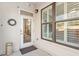 Charming entryway with white door, shuttered windows, and decorative wreath at 7250 Hwy 751 # 2109, Durham, NC 27707