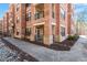 Charming brick exterior with a private entrance and walkway, framed by stone accents and landscaping at 7250 Hwy 751 # 2109, Durham, NC 27707