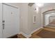 Well-lit hallway featuring neutral walls, patterned carpet, and access to residences at 7250 Hwy 751 # 2109, Durham, NC 27707
