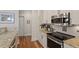 Updated kitchen with stainless steel appliances, granite countertops, and modern cabinetry at 7250 Hwy 751 # 2109, Durham, NC 27707