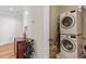 Functional laundry room with stacked washer and dryer, wine rack, and ample storage at 7250 Hwy 751 # 2109, Durham, NC 27707