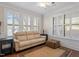 Bright living room with large windows, neutral sofa, and stylish decor at 7250 Hwy 751 # 2109, Durham, NC 27707
