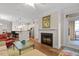 Open-concept living room showcasing seamless transitions to kitchen and fireplace at 7250 Hwy 751 # 2109, Durham, NC 27707
