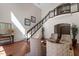 Inviting lobby with staircase, modern railings, hardwood floors, and stylish decor at 7250 Hwy 751 # 2109, Durham, NC 27707