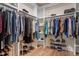 Spacious walk-in closet with custom shelving and hardwood floors at 7250 Hwy 751 # 2109, Durham, NC 27707