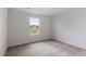 Cozy carpeted bedroom with a bright window that offers a pleasing outdoor view at 809 Rhino Bnd, Oxford, NC 27565