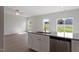 Spacious room featuring hardwood flooring, stainless steel appliances, and bright natural light at 809 Rhino Bnd, Oxford, NC 27565