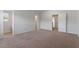 Bedroom featuring carpet flooring and multiple entryways to the bathroom and closet at 809 Rhino Bnd, Oxford, NC 27565