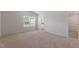 Primary bedroom with natural lighting, carpet flooring, and an ensuite bathroom at 809 Rhino Bnd, Oxford, NC 27565
