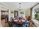 Elegant dining room featuring fine china, an inviting table setting, and beautiful natural light at 8809 Farrington Mill Rd, Chapel Hill, NC 27517