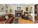 Cozy living room with a brick fireplace and comfortable seating at 8809 Farrington Mill Rd, Chapel Hill, NC 27517