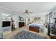 Spacious main bedroom features a ceiling fan, carpet, and private door leading to an outdoor space at 8809 Farrington Mill Rd, Chapel Hill, NC 27517
