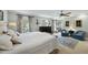 Comfortable main bedroom with ceiling fan, sitting area, and ample natural light at 8809 Farrington Mill Rd, Chapel Hill, NC 27517