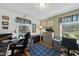 Inviting office with built-in desk, filing cabinets, natural light, and carpet with a blue rug at 8809 Farrington Mill Rd, Chapel Hill, NC 27517