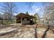 Well-maintained run-in shed with fencing and a dirt ground for livestock at 8809 Farrington Mill Rd, Chapel Hill, NC 27517