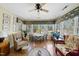 Inviting sunroom with ample natural light, comfortable seating, and delightful botanical accents at 8809 Farrington Mill Rd, Chapel Hill, NC 27517
