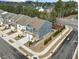 A new two-story townhome displays modern architecture, landscaping, and corner lot appeal at 1000 Pyrenees Way, Cary, NC 27519