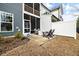 Spacious backyard featuring a patio with outdoor seating, perfect for entertaining and relaxation at 1000 Pyrenees Way, Cary, NC 27519