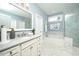 Elegant bathroom with double sinks, separate soaking tub, and a luxurious walk-in shower at 1000 Pyrenees Way, Cary, NC 27519
