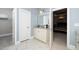 This bathroom features a white vanity with a marble countertop, a private toilet, and access to the living room at 1000 Pyrenees Way, Cary, NC 27519