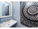 Modern bathroom featuring a sleek vanity, stylish mirror, and contemporary decor creating a spa-like retreat at 1000 Pyrenees Way, Cary, NC 27519