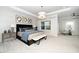 This is a spacious main bedroom showcasing large windows, a tray ceiling, and a seating area at 1000 Pyrenees Way, Cary, NC 27519
